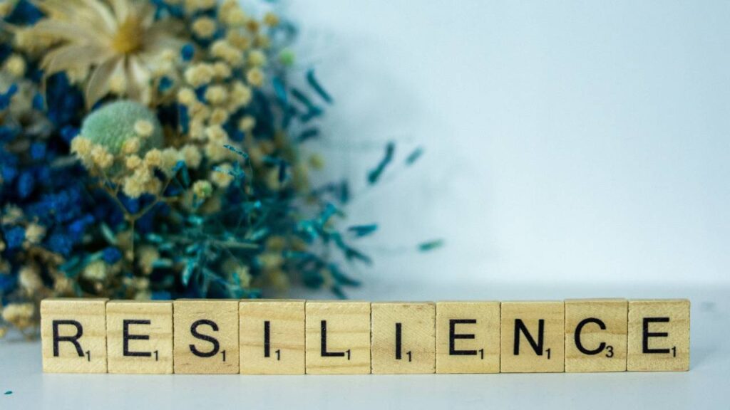 Ten wooden blocks creating the word "resillience" 