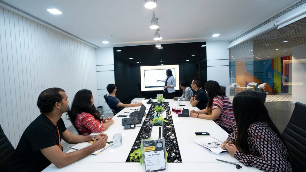 Employees attending a presentation in the conference room